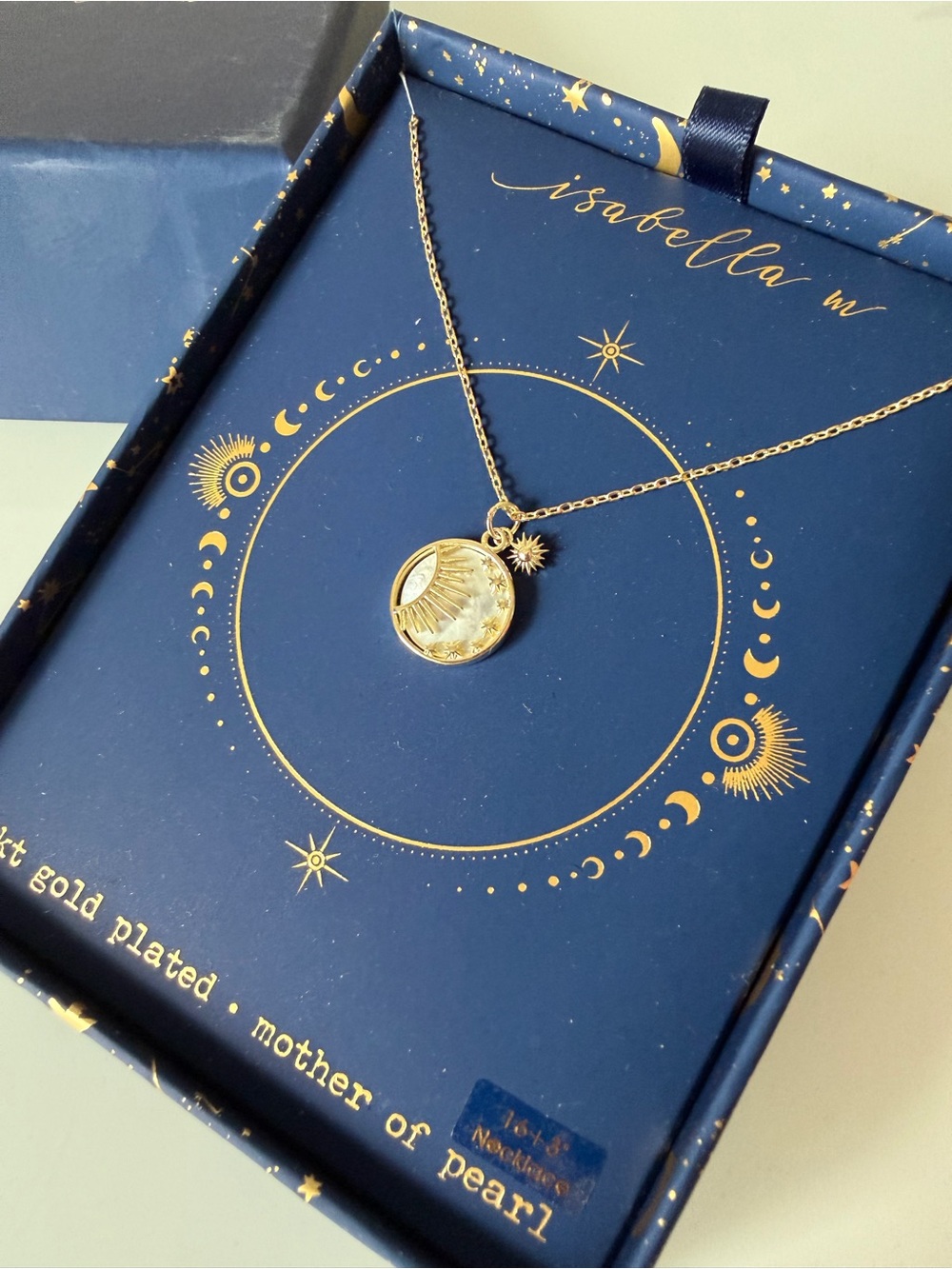 Gold mother of pearl sun charm necklace
